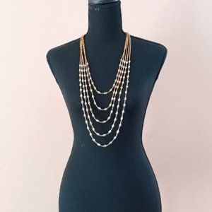 Long multi strand beaded necklace